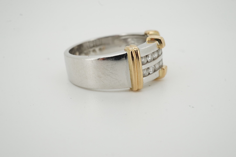 A modern two colour 10kt and two row channel set diamond dress ring, size U/V, gross weight 11.2 grams. Condition - fair to good